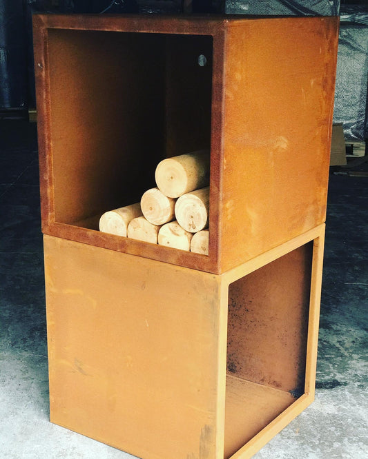 A brown corten steel wood storage unit with cubes and squares designed for firewood storage, placed indoors.