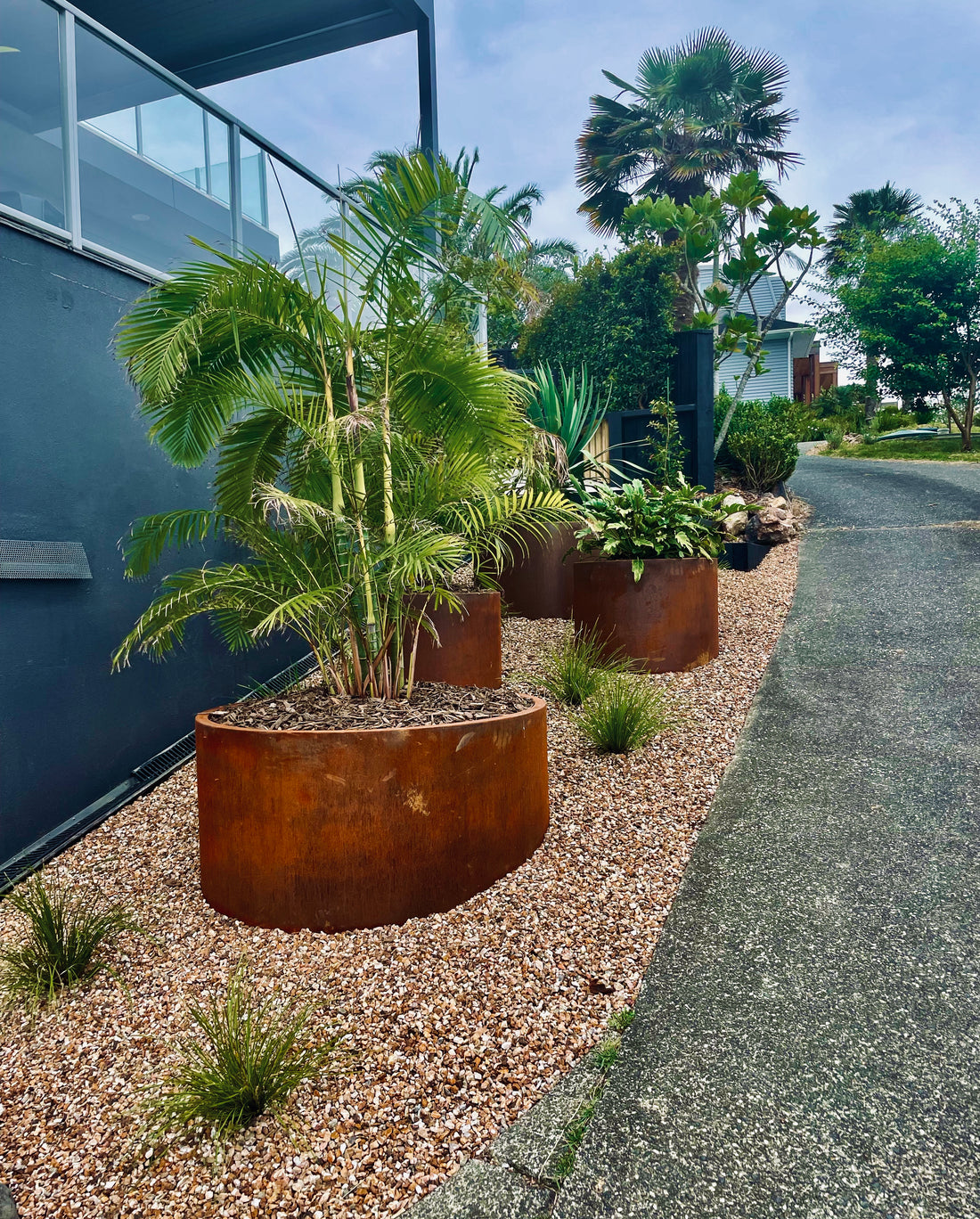 The elegance and ease of bottomless Corten planters